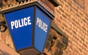 Image shows a police lamp on a building