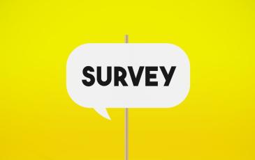 Image shows a white speech bubble with the word 'survey' on it. 
