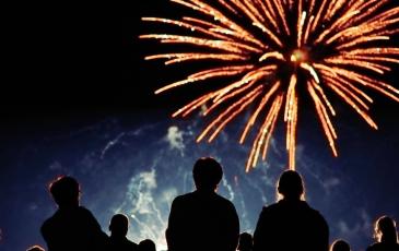 Image shows people watching a firework display. 