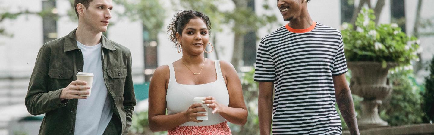 Three young people walking together outside